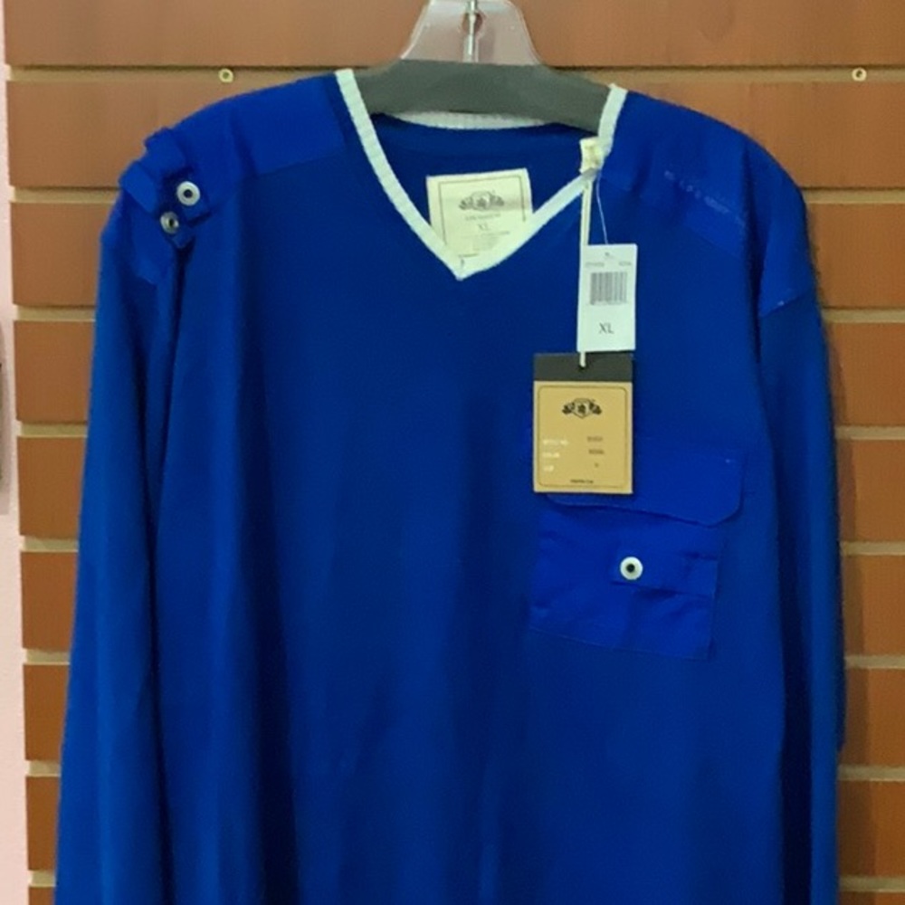New with tags long sleeve knit shirt.